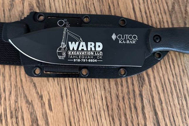 KA-BAR engraved with a company logo, location and phone number