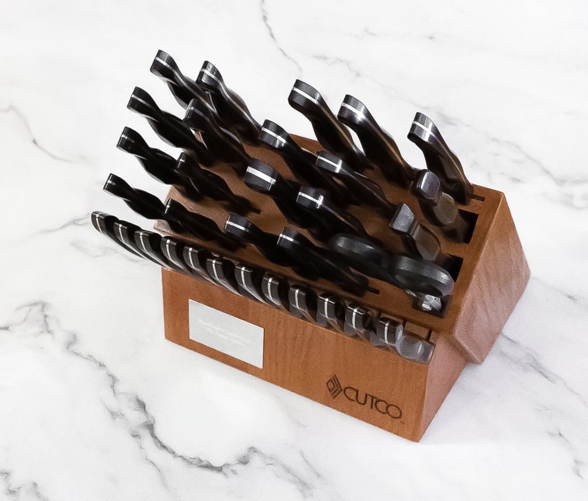 Cutco knife block with engraved plaque on a marble counter